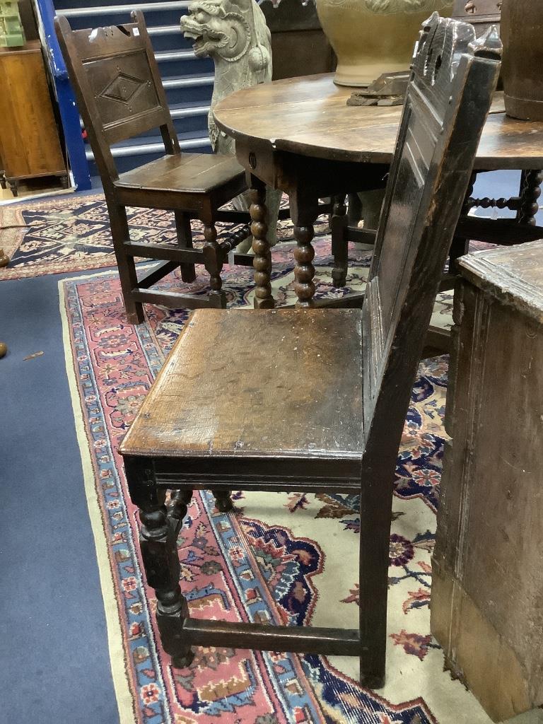 A 17th century oak back stool with bobbin front stretcher, width 47cm, depth 38cm, height 96cm